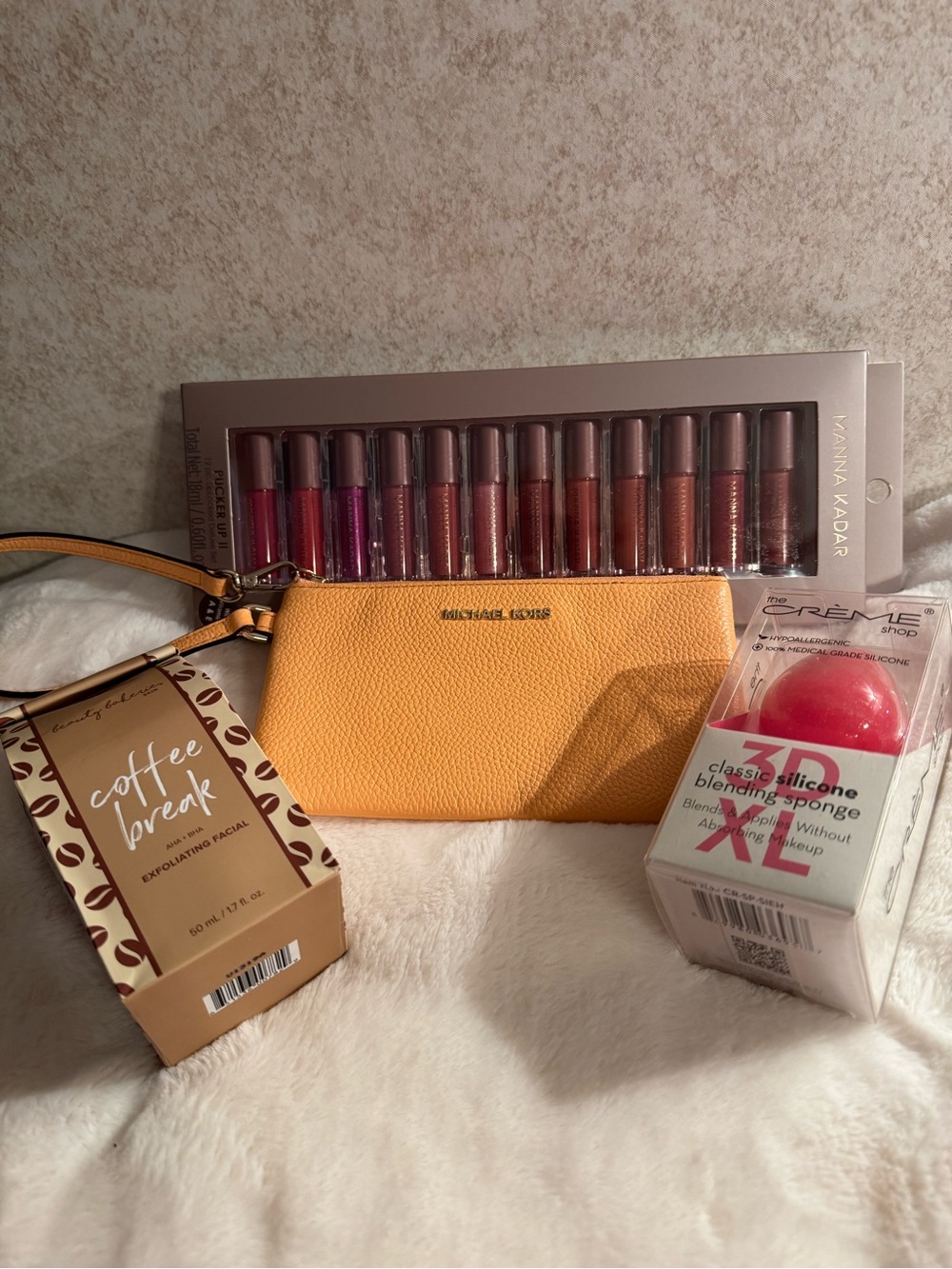 Michael Kors Peach Leather Wristlet Pouch - Plus beauty Bundle.